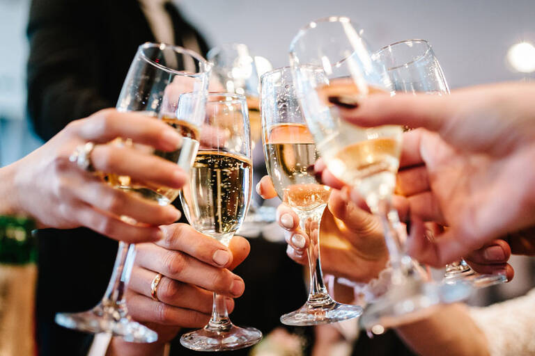 Cheers! People Celebrate And Raise Glasses Of Wine For Toast. Gr